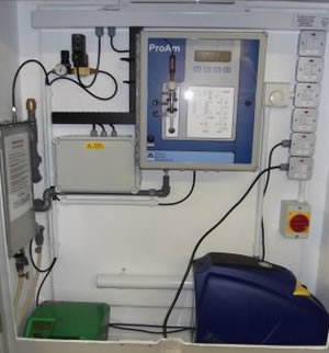 Proam ammonia monitor complete with sample acquisition, membrane filtration and compresssed air cleaning of inlet strainer pre-mounred within a small GRP enclosure